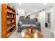Cozy finished basement with plush carpet, full size sofa, and a bookcase at 4501 Zenobia St, Denver, CO 80212