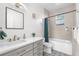 Bathroom featuring a shower and bathtub combo, and double sink at 4501 Zenobia St, Denver, CO 80212