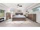 Spacious bedroom with a ceiling fan, and bright windows at 4501 Zenobia St, Denver, CO 80212