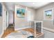 Hallway with wooden floors and an art piece at 4501 Zenobia St, Denver, CO 80212