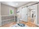 Hallway with a sliding barn door at 4501 Zenobia St, Denver, CO 80212