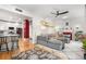 Open-concept living space with modern gray couch, overhead fan, and modern decor at 4501 Zenobia St, Denver, CO 80212