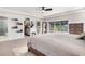 Open bedroom with a walk-in closet, large bed, and bright windows at 4501 Zenobia St, Denver, CO 80212