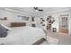 Open bedroom with a walk-in closet, large bed, and bright windows at 4501 Zenobia St, Denver, CO 80212