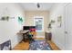 Comfortable home office with hardwood floors, desk, and a bright window view at 4501 Zenobia St, Denver, CO 80212