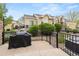 A backyard with a fence, patio, landscaping and views of the home's exterior at 22342 E Plymouth Cir, Aurora, CO 80016