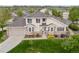 Beautiful two-story home featuring manicured lawn, attached garage, and stone and stucco exterior at 22342 E Plymouth Cir, Aurora, CO 80016