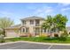 Charming two-story home featuring a well-maintained lawn, stone accents, and a welcoming front entrance at 22342 E Plymouth Cir, Aurora, CO 80016