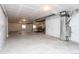 Unfinished basement area with concrete flooring and drop ceiling at 2149 Indian Balsam Dr, Monument, CO 80132