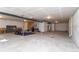 Unfinished basement area with concrete flooring and a drop ceiling with visible ducts at 2149 Indian Balsam Dr, Monument, CO 80132