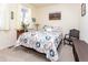 Relaxing bedroom featuring a patterned quilt, bright window and decor at 2149 Indian Balsam Dr, Monument, CO 80132