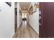 Long hallway showcasing hardwood floors, recessed lighting and beautiful decor at 2149 Indian Balsam Dr, Monument, CO 80132