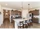 Spacious kitchen featuring an island with bar stool seating and stainless steel appliances at 2149 Indian Balsam Dr, Monument, CO 80132