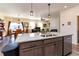 Open-concept kitchen featuring granite countertops and views into dining and living area at 2149 Indian Balsam Dr, Monument, CO 80132