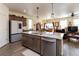 Modern kitchen with stainless steel appliances, an island with granite countertops, and open layout to dining at 2149 Indian Balsam Dr, Monument, CO 80132