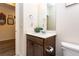 Bathroom with a single sink, white countertops, and wood-finish cabinetry at 2149 Indian Balsam Dr, Monument, CO 80132