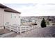 View of backyard, fence line, and neighborhood featuring homes and a mountain range in the distance at 3910 Mighty Oaks St, Castle Rock, CO 80104