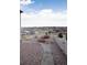 Backyard is gravel-covered and contains a stone pathway with mountain views at 3910 Mighty Oaks St, Castle Rock, CO 80104