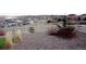 Landscaped backyard with a white picket fence and distant mountain views at 3910 Mighty Oaks St, Castle Rock, CO 80104