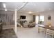 Open basement with carpet, tv, and dining area. Has a wood panel wall and includes recessed lighting at 3910 Mighty Oaks St, Castle Rock, CO 80104
