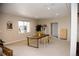 Finished basement area with dining table, neutral paint, large windows, recessed lighting, and carpeted floors at 3910 Mighty Oaks St, Castle Rock, CO 80104