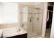 Bright bathroom with soaking tub and clear glass enclosed shower with tile surround at 3910 Mighty Oaks St, Castle Rock, CO 80104