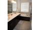 Bathroom with white countertop, large soaking tub, and glass enclosed shower at 3910 Mighty Oaks St, Castle Rock, CO 80104