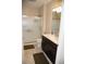 Clean bathroom featuring glass shower and dark vanity at 3910 Mighty Oaks St, Castle Rock, CO 80104