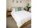 Bright bedroom boasts natural light, wood accents, and minimalist decor at 3910 Mighty Oaks St, Castle Rock, CO 80104