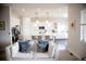 Comfortable living room showcasing an open layout to a kitchen, creating a modern and inviting space at 3910 Mighty Oaks St, Castle Rock, CO 80104