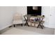 Cozy sitting area features a comfortable chair and rustic media center at 3910 Mighty Oaks St, Castle Rock, CO 80104