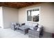 Inviting covered patio space with comfortable seating, perfect for outdoor entertainment and relaxation at 3910 Mighty Oaks St, Castle Rock, CO 80104