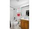 Bathroom featuring a shower and bathtub with tiled surround and a wooden vanity with large mirror at 2277 S Buckley Rd # 102, Aurora, CO 80013