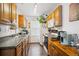 Well-lit kitchen featuring hardwood floors, modern appliances, and ample countertop space at 2277 S Buckley Rd # 102, Aurora, CO 80013