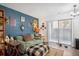 Comfortable living room with stylish decor, plush seating, and sliding glass door at 2277 S Buckley Rd # 102, Aurora, CO 80013