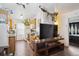 Bright open concept living and kitchen area with hardwood floors and ample light at 2277 S Buckley Rd # 102, Aurora, CO 80013
