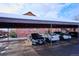 Outdoor parking area with covered parking stalls and space for multiple vehicles at 2277 S Buckley Rd # 102, Aurora, CO 80013