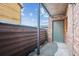 Private outdoor patio area with brick wall and wood fence at 2277 S Buckley Rd # 102, Aurora, CO 80013