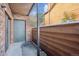 Private outdoor patio area with brick wall and wood fence at 2277 S Buckley Rd # 102, Aurora, CO 80013