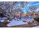 Community pool area is covered for the winter season in a snow-covered setting at 2277 S Buckley Rd # 102, Aurora, CO 80013