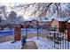 The community pool is closed for the winter season, covered with a blue tarp and snow at 2277 S Buckley Rd # 102, Aurora, CO 80013