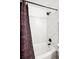 Shower and bathtub featuring tiled surround and black shower hardware at 2277 S Buckley Rd # 102, Aurora, CO 80013