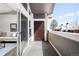 Outdoor balcony with sliding glass doors and view into the living room, offering seamless indoor-outdoor living at 14353 E 1St Dr # 301, Aurora, CO 80011