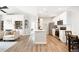 Bright kitchen featuring stainless steel appliances, white cabinets, and a center island with counter seating at 14353 E 1St Dr # 301, Aurora, CO 80011