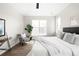 A bright and airy main bedroom featuring a large window and a modern ceiling fan at 14353 E 1St Dr # 301, Aurora, CO 80011