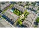 Aerial view of the community highlighting manicured green spaces, walking paths, and a refreshing community pool at 9637 E 5Th Ave # 101, Denver, CO 80230