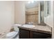 Bathroom featuring a vanity with granite countertops and tile shower at 9637 E 5Th Ave # 101, Denver, CO 80230