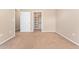Bedroom with a closet and neutral carpeting at 9637 E 5Th Ave # 101, Denver, CO 80230