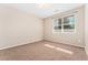 Bedroom with neutral walls, carpet, and natural light at 9637 E 5Th Ave # 101, Denver, CO 80230
