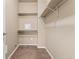 Walk-in closet with built-in shelving and ample storage space at 9637 E 5Th Ave # 101, Denver, CO 80230